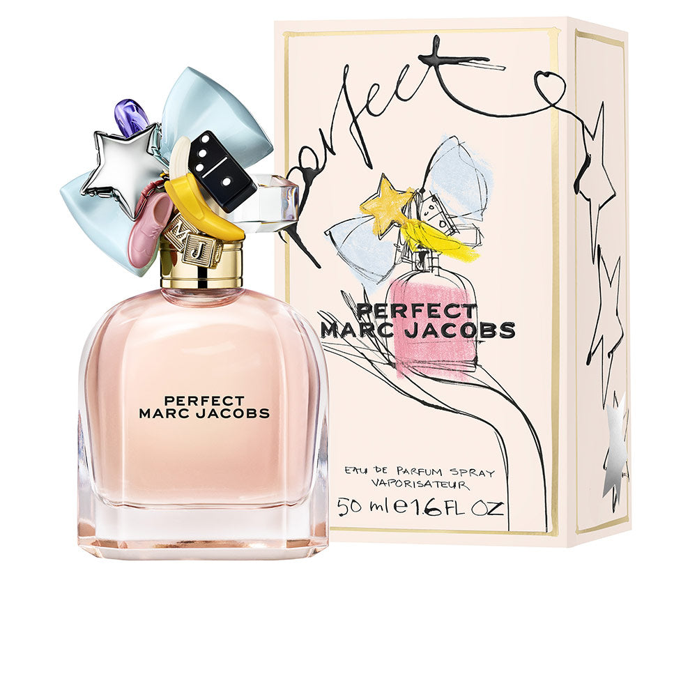 Rounded glass bottle with pink perfume and decorative charms, 50 ml