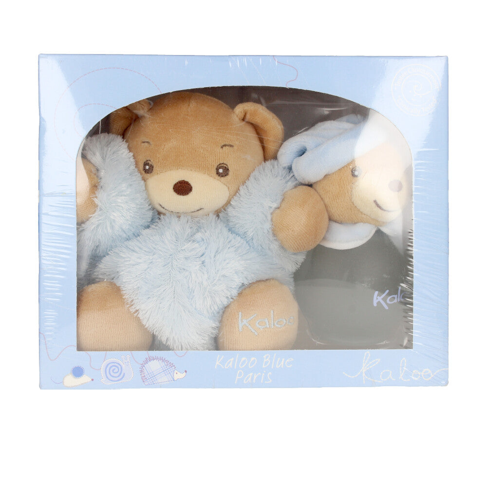 Rounded translucent glass fragrance bottle with teddy-head cap and matching plush bear