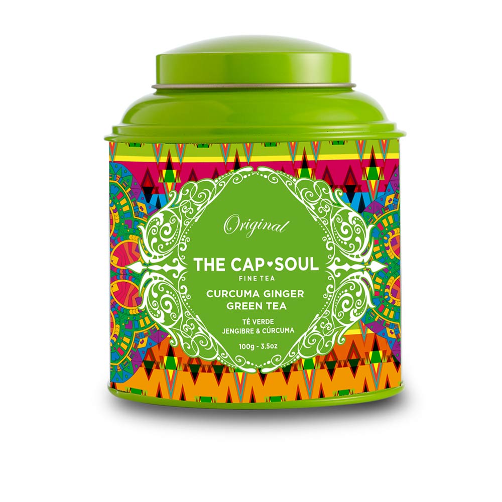 Loose-leaf green tea blend with visible ginger and turmeric pieces, 100 g pouch