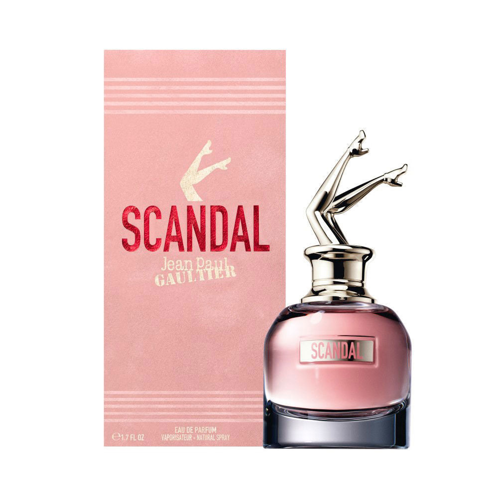 50 ml sculptural glass perfume bottle with soft-pink sleeve and red detail