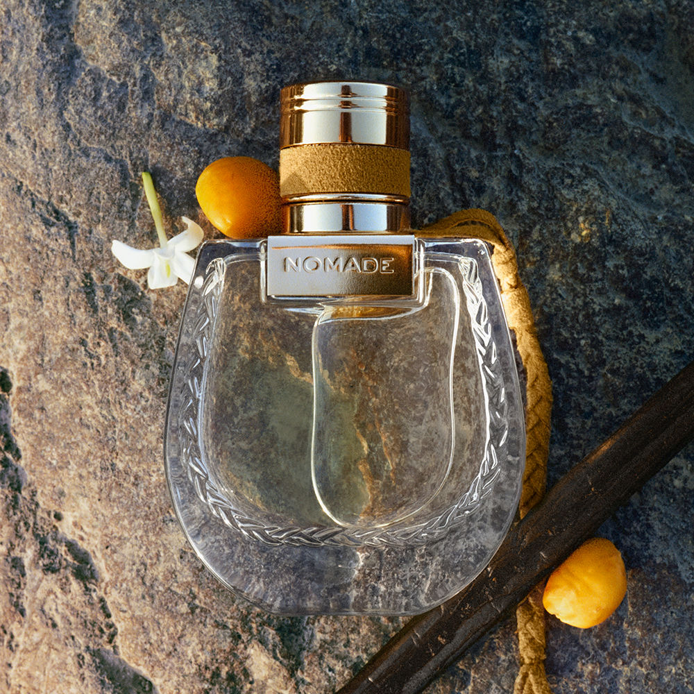 30 ml amber‑tone glass perfume bottle with braided neck detail