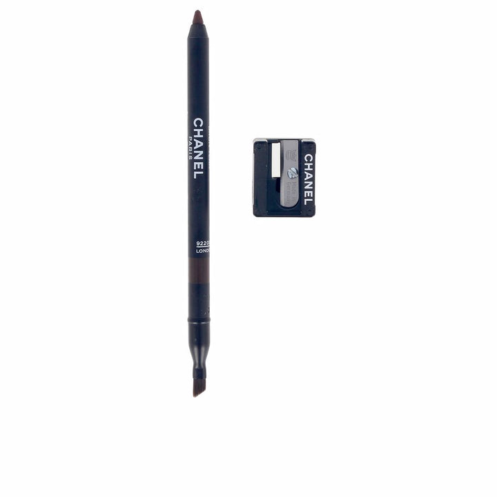 Slim creamy eye pencil in deep teak shade, pointed tip visible