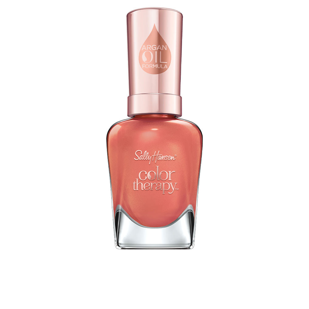 Bottle of coral shimmer nail polish with argan oil, 14.7 ml
