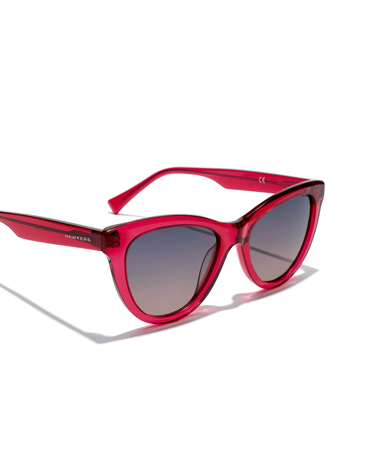 Unisex cat‑eye sunglasses in translucent cherry acetate with grey‑to‑pink gradient lenses