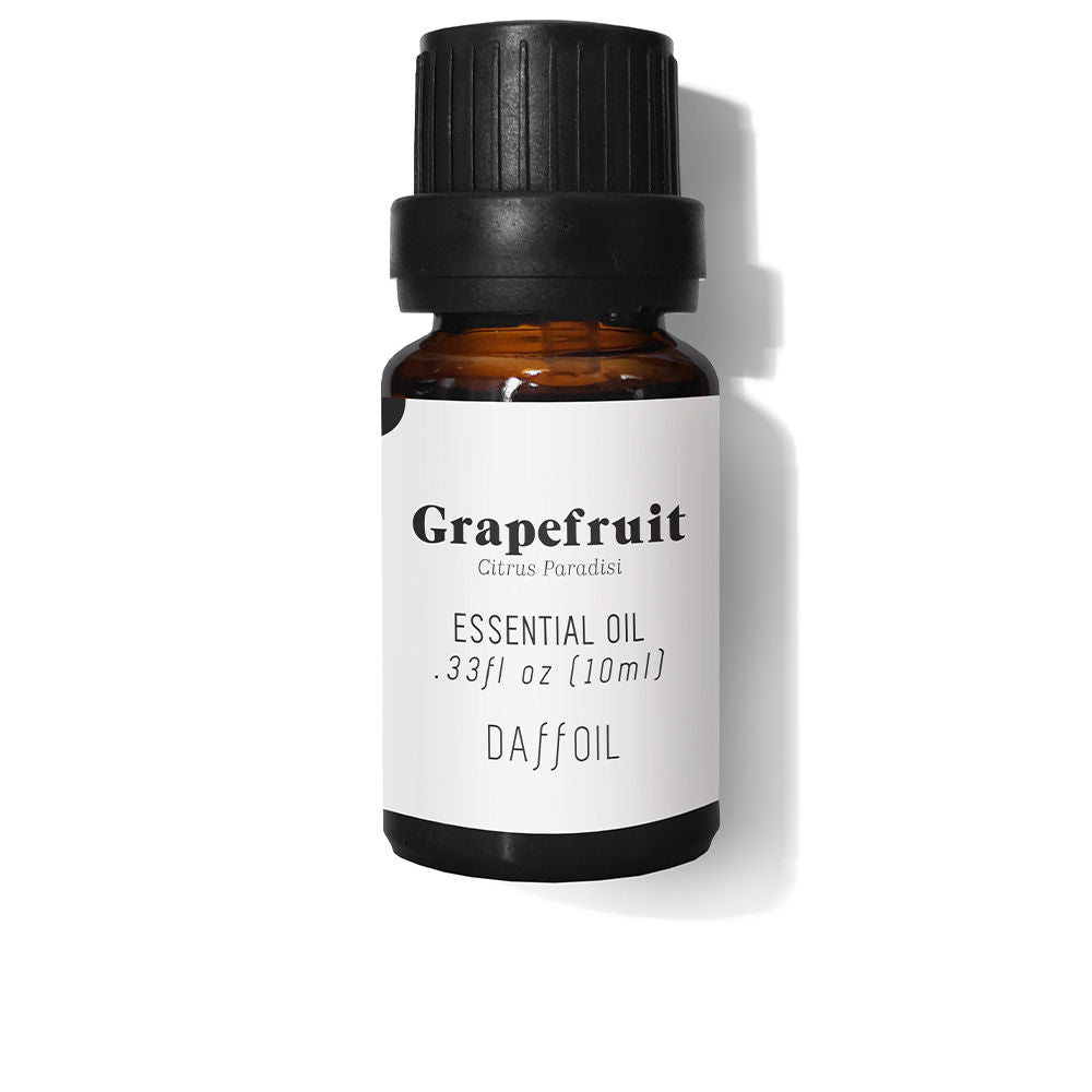 Small amber bottle of grapefruit essential oil with citrus fruit, 10 ml