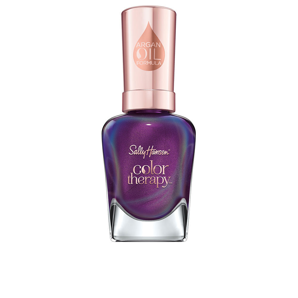 Small 14.7 ml bottle of sheer plum nail polish with argan oil label