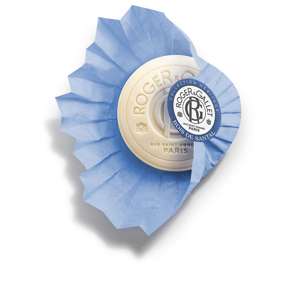 Cream and blue round soap wrapped in pleated paper with embossed text and circular label, Roger &amp; Gallet
