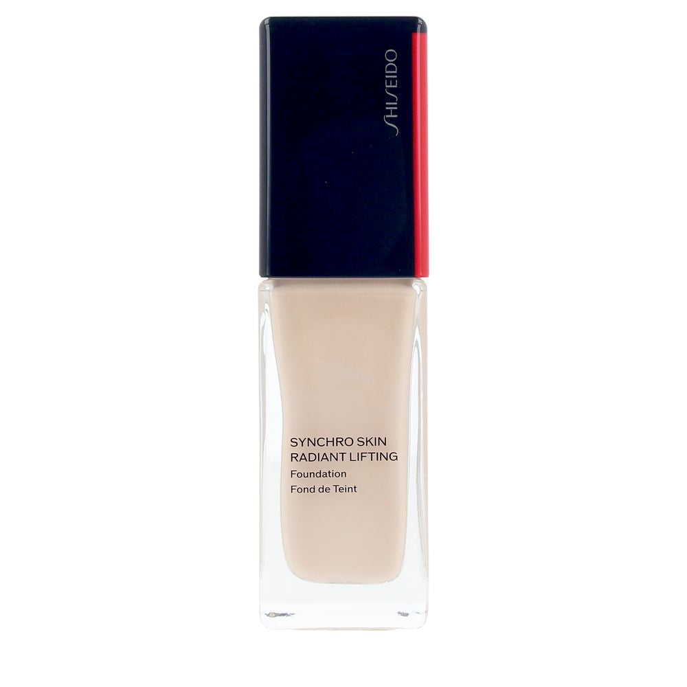 Shiseido Glass rectangular foundation bottle showing beige liquid, black cap with red stripe and printed text