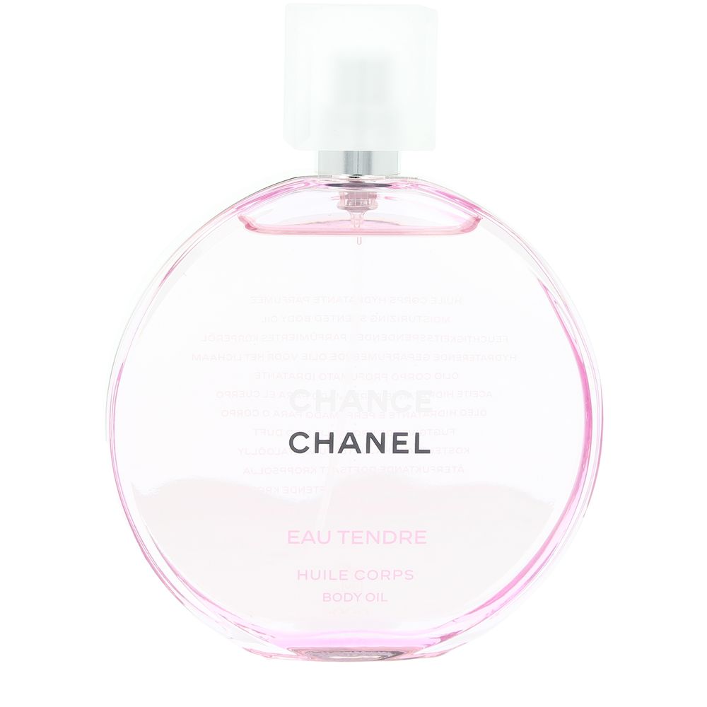 Pink-hued glass body oil bottle with spray nozzle and white cap, round shape, printed text, Chanel