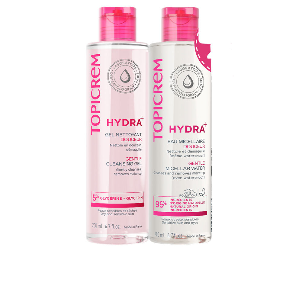 Topicrem Transparent plastic cleansing gel bottle with pink flip-top cap, bold pink typography, measurement markings