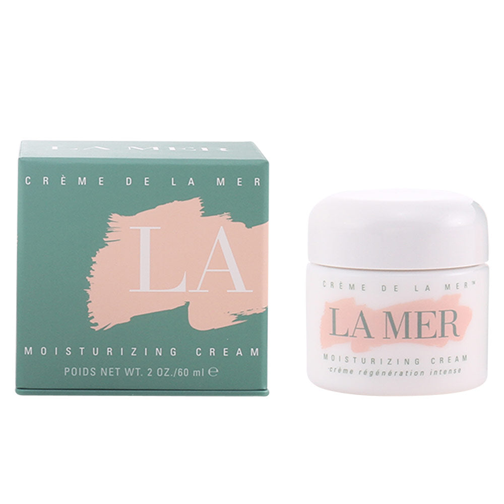 Minimalist green, white, and pink boxed moisturizing cream in a small plastic jar with printed text, La Mer