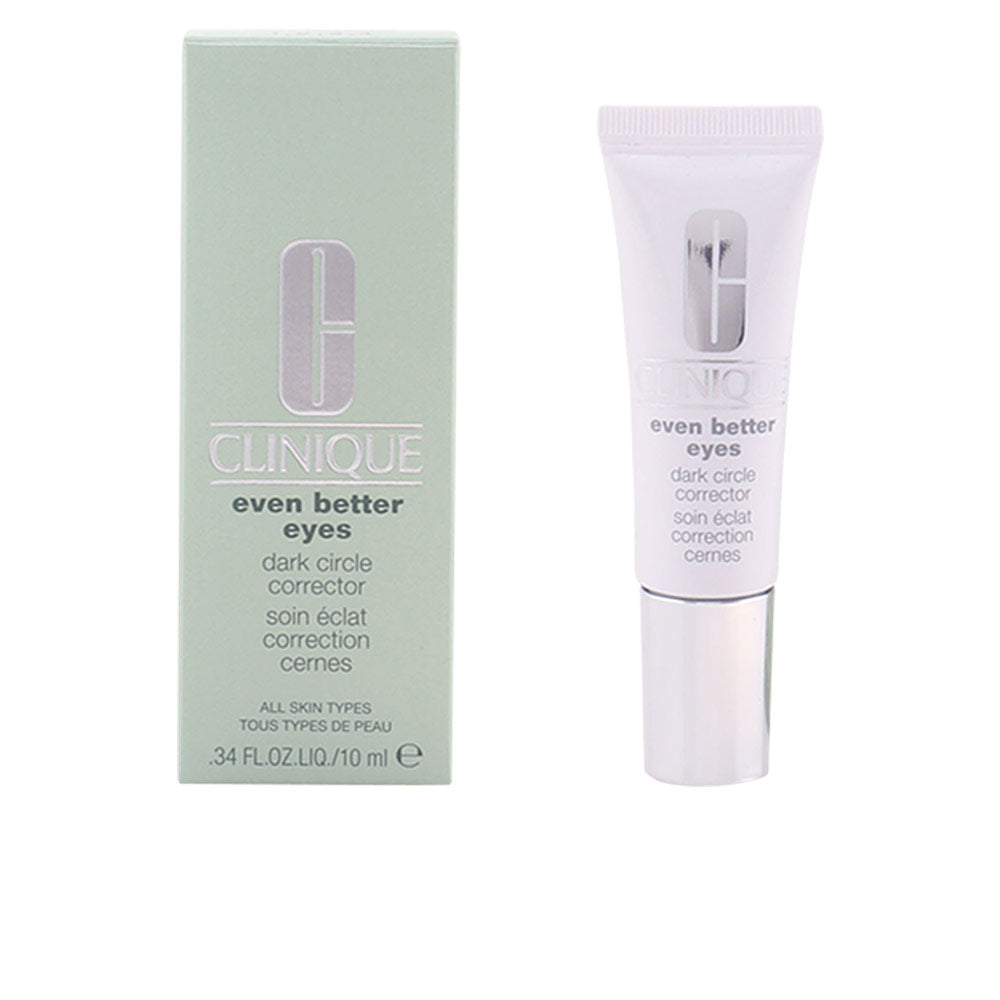 Tube of Clinique Even Better Eyes concealer beside a soft applicator on neutral background