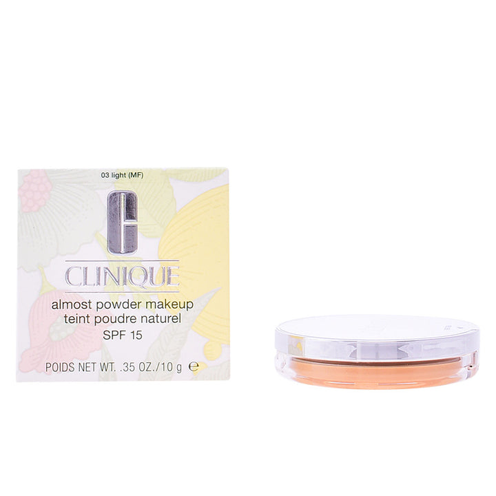 Compact pressed powder foundation in light shade with mini brush, SPF 15