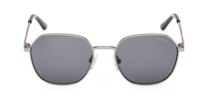 Unisex silver hexagonal sunglasses, dark gray lenses, thin metal frame, black temple tips, branded temples
