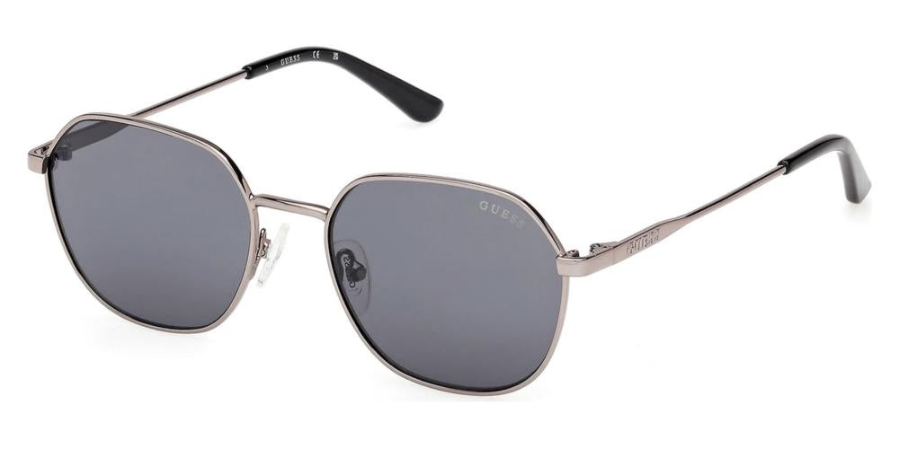 Unisex silver hexagonal sunglasses, dark gray lenses, thin metal frame, black temple tips, branded temples
