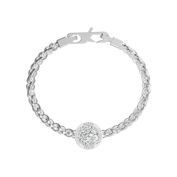 Silver chain bracelet with round lion head medallion on lobster clasp, styled on neutral background