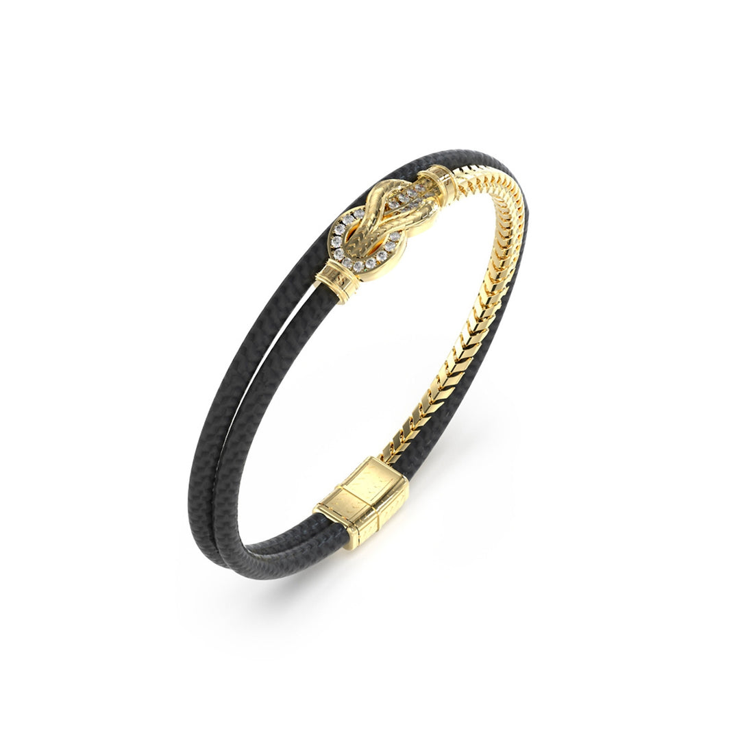 Unisex black double-band leather bracelet with gold clasp and diamond-studded knot detail on wrist