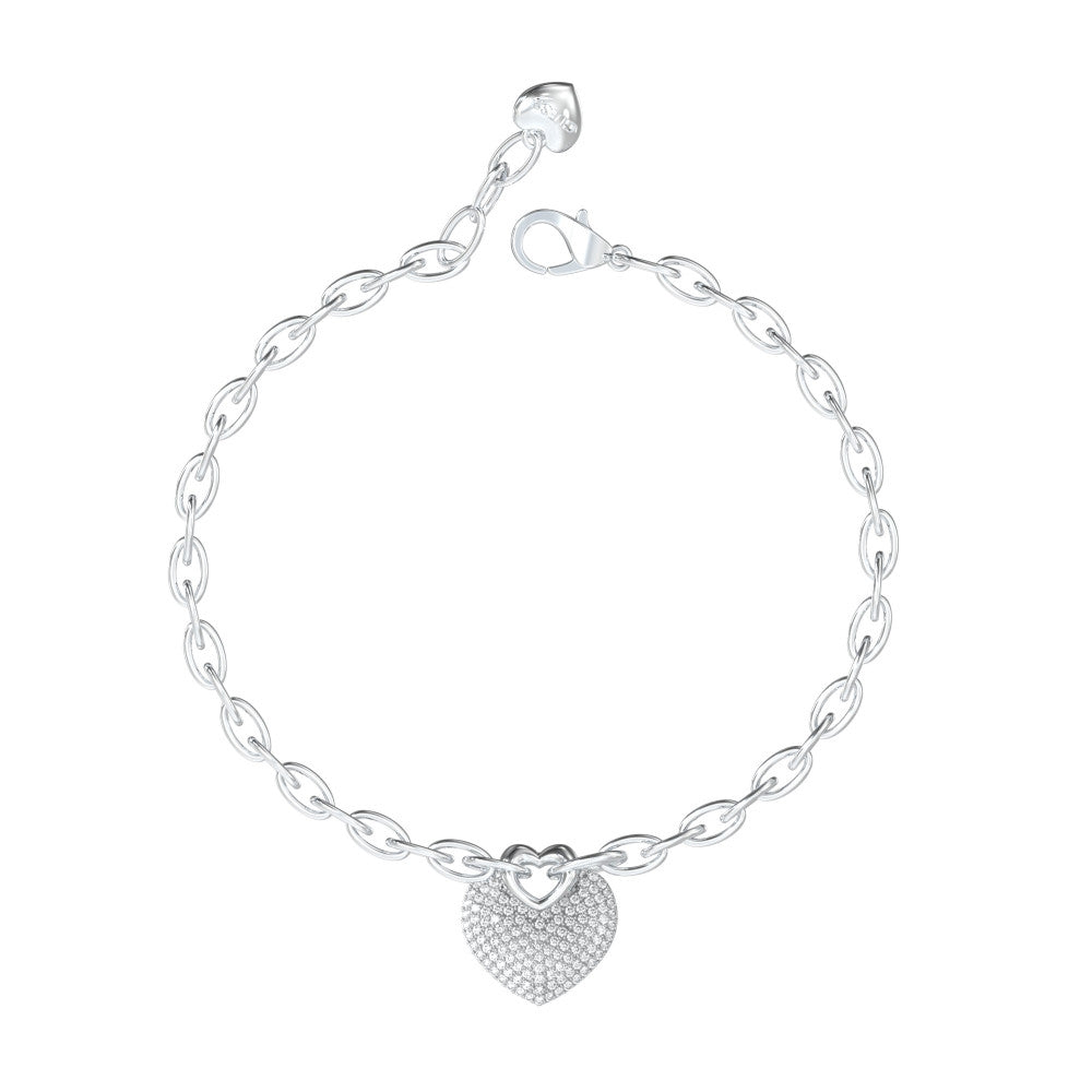 Silver chain charm bracelet for Women with heart-shaped charm and lobster clasp on white background